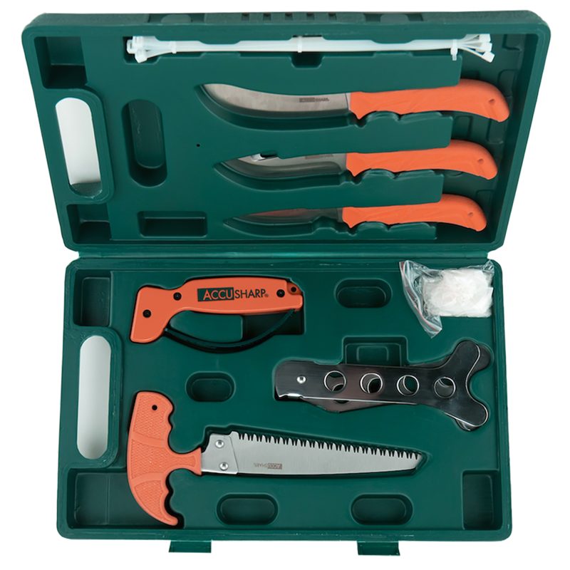 AccuSharp Game Processing Kit with orange-handled knives, bone saw, ribcage spreader, and sharpener, all in a black hard-side carry case.