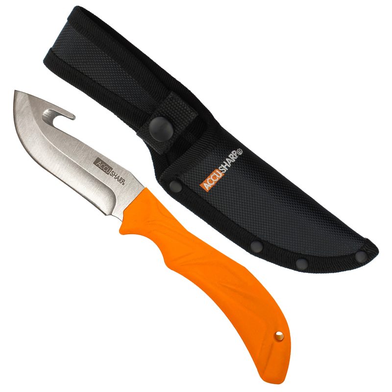 AccuSharp Gut-Hook Knife with orange handle and stainless steel blade, shown with black sheath on a rustic background.