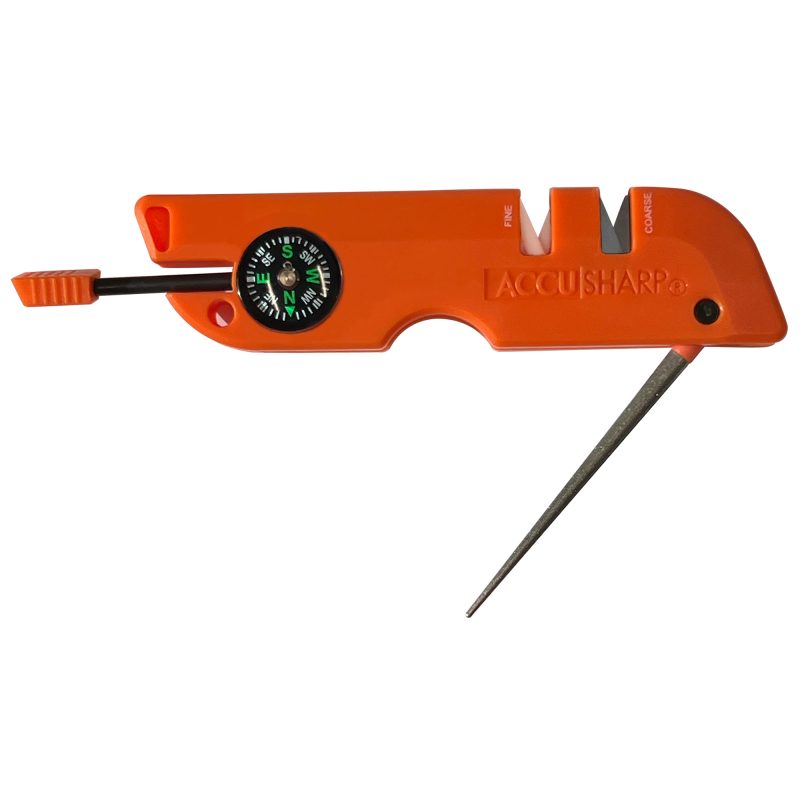 Orange AccuSharp Outdoor Survival Tool with multiple functions visible, including sharpening slots, compass, and whistle, ready for use in the White Mountains.