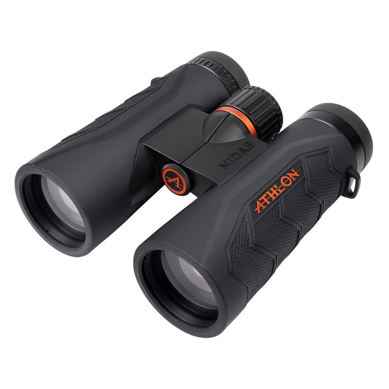 ATHLON Midas G2 8X42 UHD Binoculars, black, shown with lens caps, on a rugged outdoor surface, ready for use in the White Mountains.