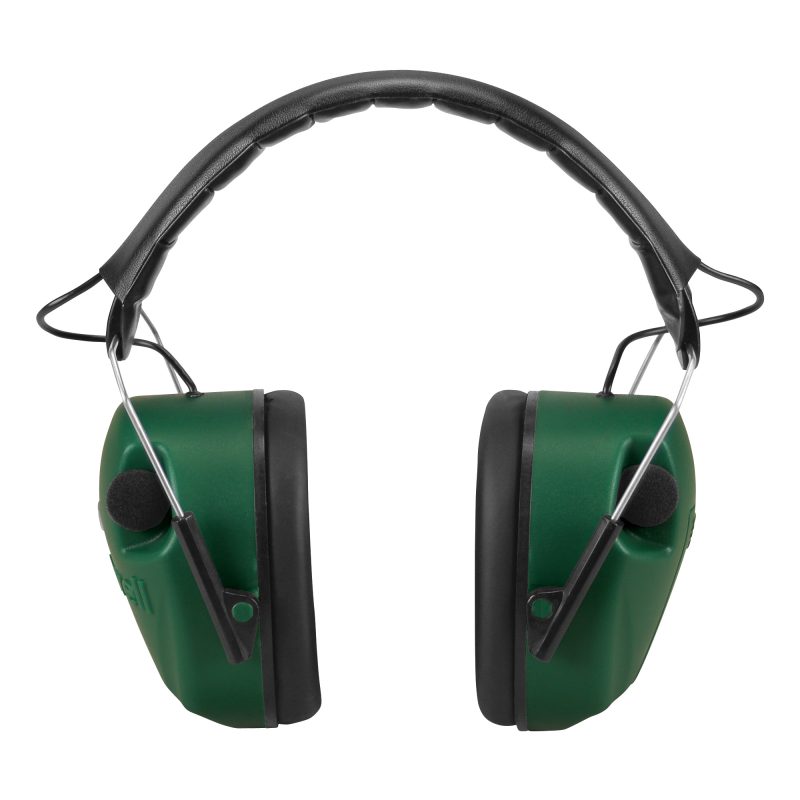 Green Caldwell E-Max Electronic Earmuffs with black ear cups and headband, shown ready for use in a rugged outdoor setting.