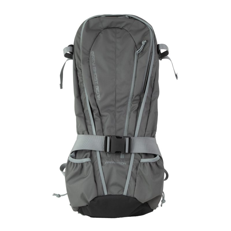Solid grey Grey Ghost Gear Apparition Bag, a discreet backpack designed for carrying compact gear, shown against an outdoor background.