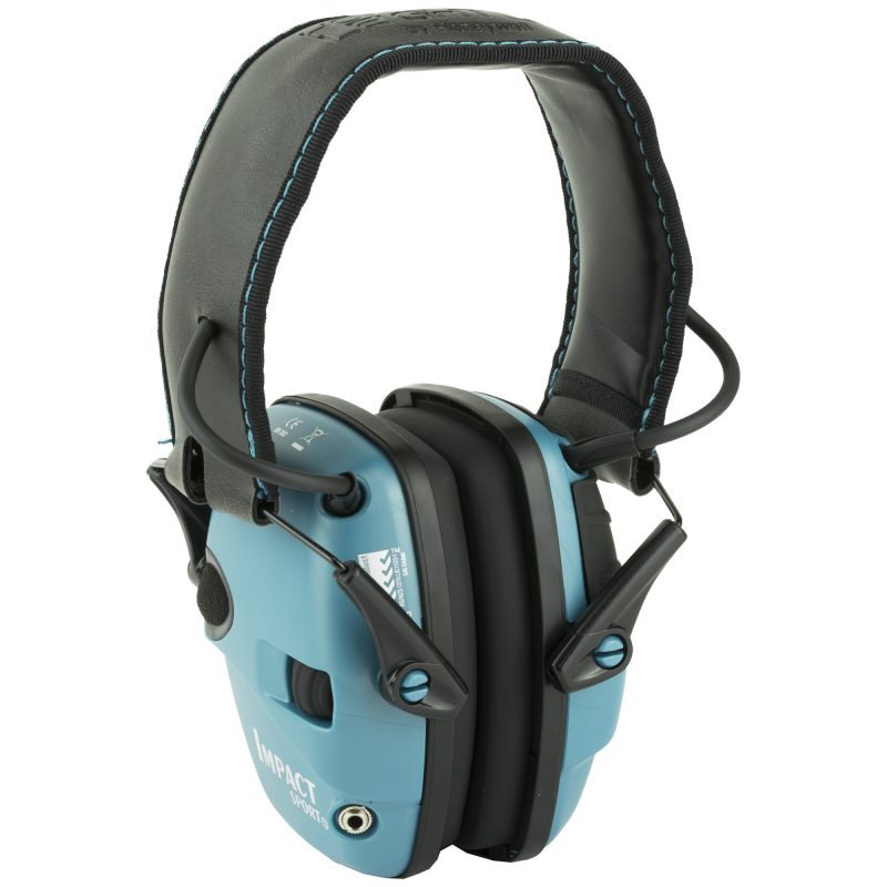 Teal Howard Leight Impact Sport electronic earmuffs, folded, shown on a rustic wooden surface, ready for use on a ranch or job site.