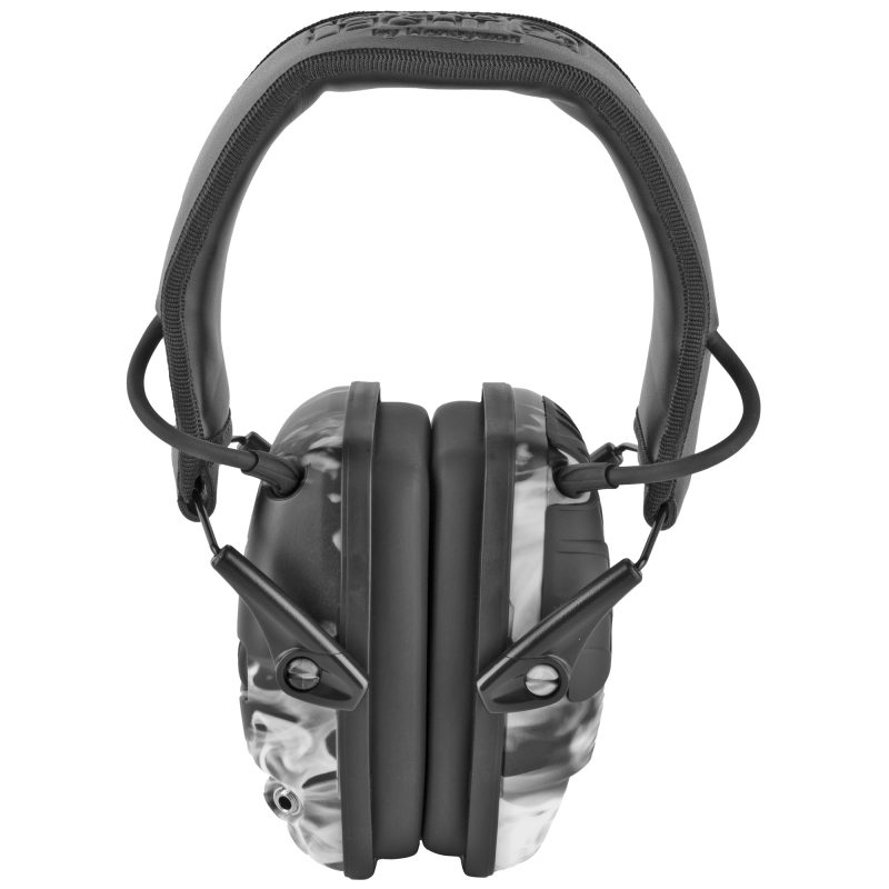 Howard Leight Impact Sport electronic earmuffs in smoke finish, folded, on a rugged surface, ready for use in the White Mountains of Arizona.