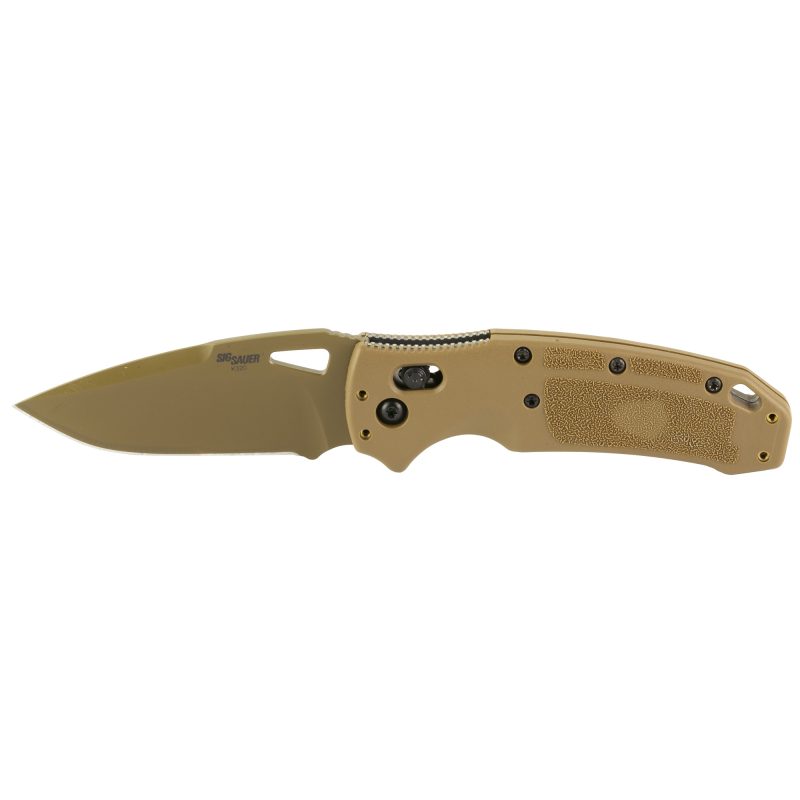 Hogue Sig K320 M17 folding knife with a tan handle and a PVD finished drop point blade, shown open on a rugged surface, suitable for ranch work in the White Mountains.