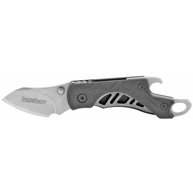 Kershaw Cinder 1.4 inch stonewashed folding knife with black handle, shown open on a rustic surface.