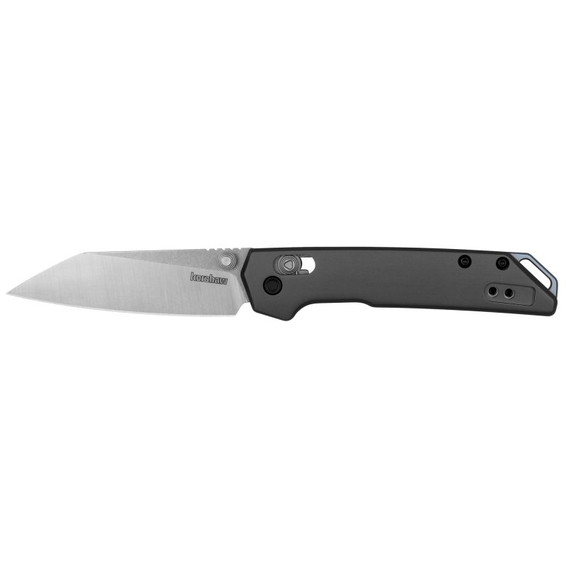 Kershaw Mini Iridium folding knife with a 3-inch silver reverse tanto D2 steel blade and a gray anodized aluminum handle, shown open on a rustic surface.