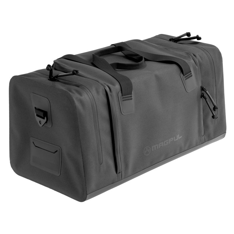Large black Magpul Industries DAKA Range Bag with reinforced handles and shoulder strap attachment points, shown ready for heavy-duty use.