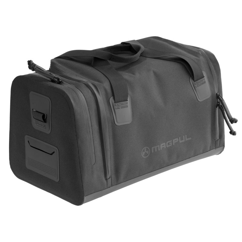 Black Magpul Daka Range Bag, small size, with reinforced handles and shoulder strap attachment points, shown ready for use.