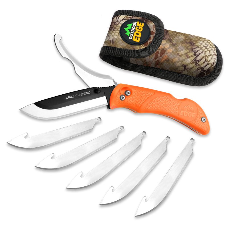 Outdoor Edge Razor-Pro G folding knife with bright orange handle, showing both a drop point replacement blade and a gutting blade, on a rugged outdoor background.
