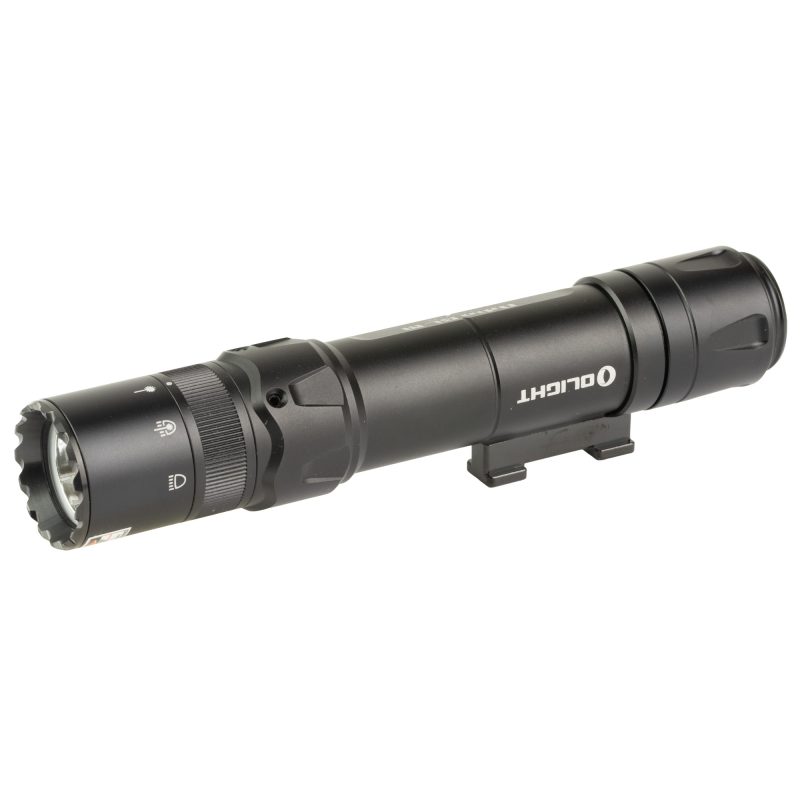 Black Olight Odin GL M-LOK 1500 lumen weapon light with green laser attached to a rifle, shown in a rugged outdoor setting.