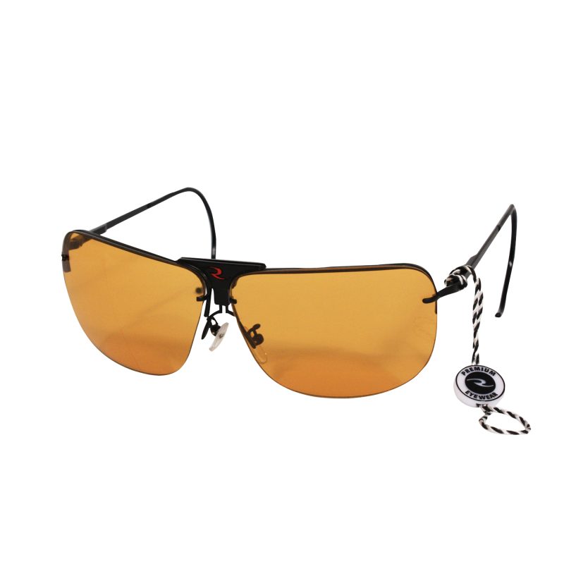 Radians RSG-3 interchangeable shooting glasses with clear, orange, and amber lenses displayed on a rugged surface.