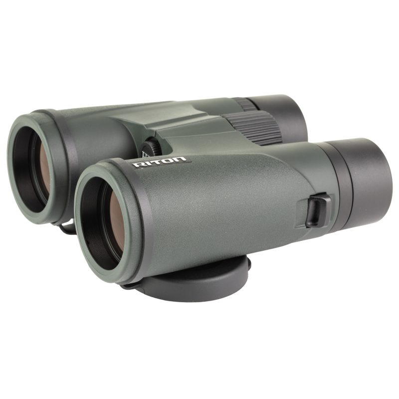 A pair of black Riton Optics 3 Primal 10X42 HD binoculars with lens caps, shown against an outdoor background, emphasizing their rugged design.