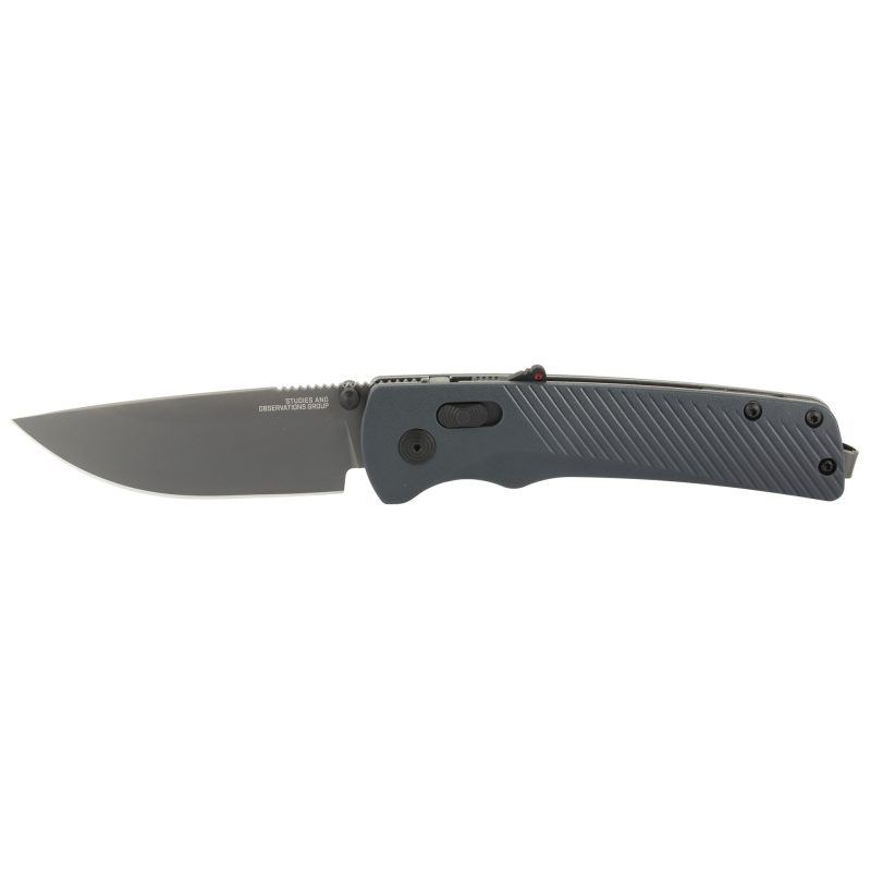 SOG Knives & Tools Flash AT folding knife with a 3.45-inch straight back D2 steel blade, titanium nitride finish, and urban gray GRN handle, shown open on a rustic surface.