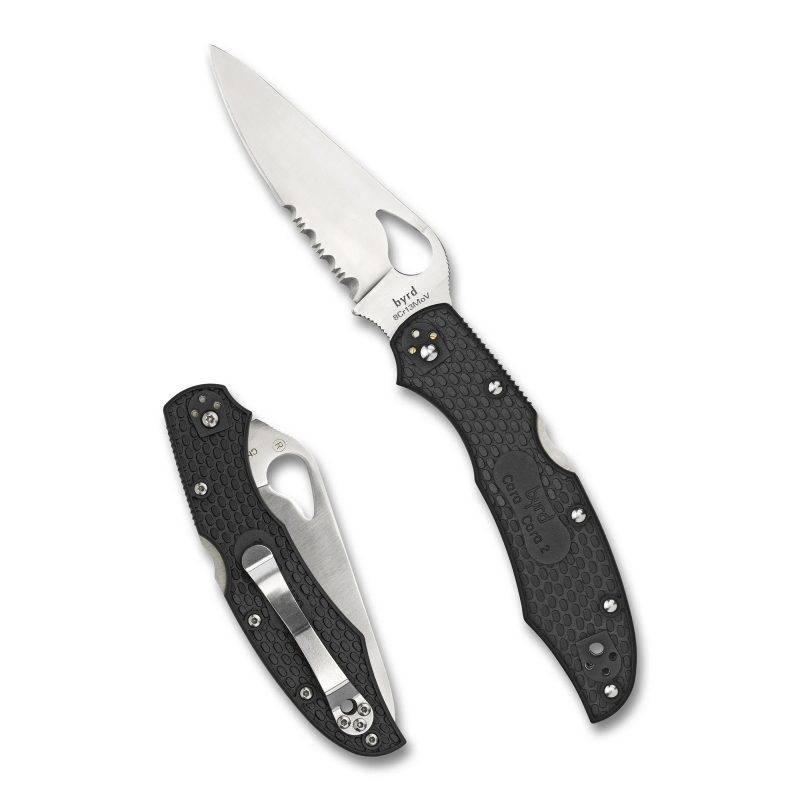 Spyderco Byrd Cara Cara 3.75 inch combo edge folding knife with black handle and satin blade, shown open on a rustic surface.