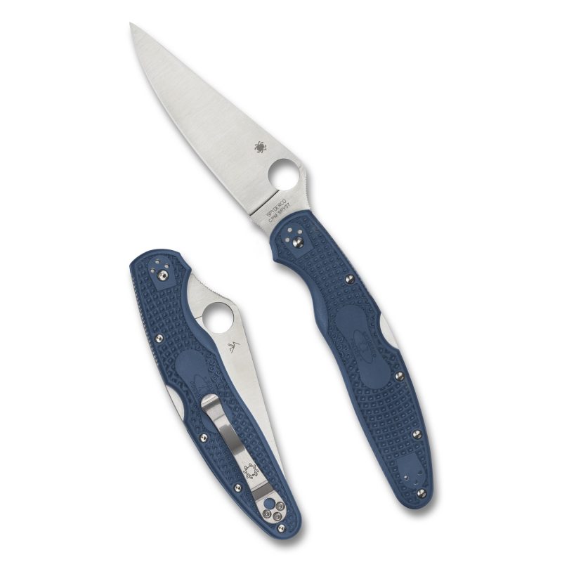Spyderco Police 4 Lightweight folding knife with a blue FRN handle and a satin finish, plain edge blade, shown open on a rustic surface.