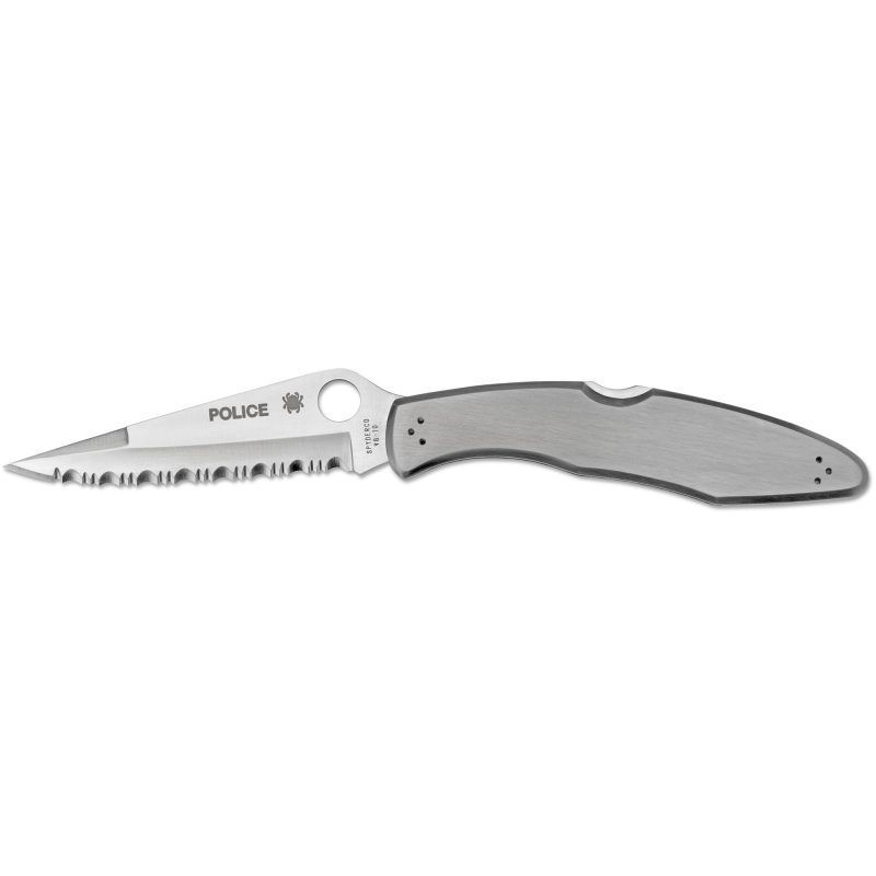 Spyderco Police Stainless SpyderEdge folding knife with a serrated clip point blade and stainless steel handle, shown open on a rustic surface.