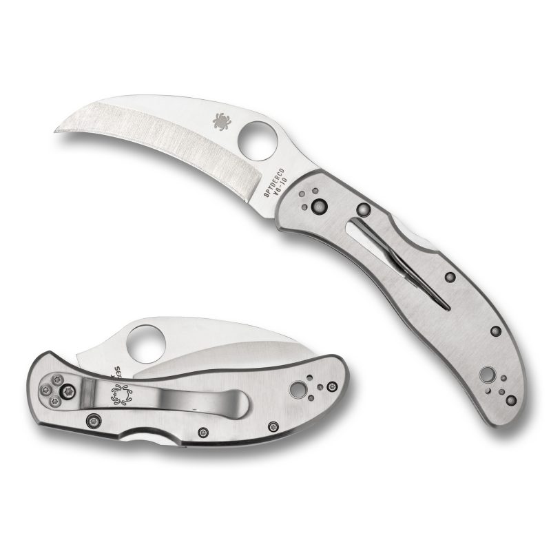 Spyderco Harpy Clipit folding knife with a silver stainless steel hawkbill blade and handle, shown open on a rugged background.