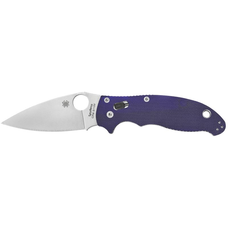 Spyderco Manix 2 G-10 Dark Blue folding knife with a 3.375-inch CPM S110V blade, open and ready for use, shown on a rugged outdoor surface.