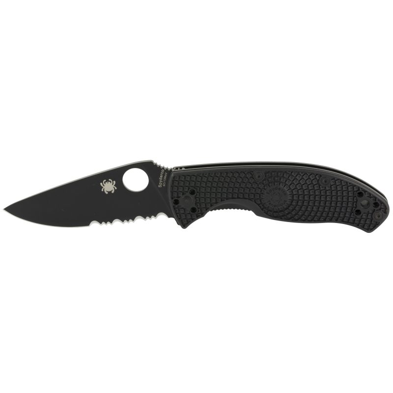 Spyderco Tenacious Lightweight folding knife with a black FRN handle and a satin-finished blade, shown open on a rustic surface.