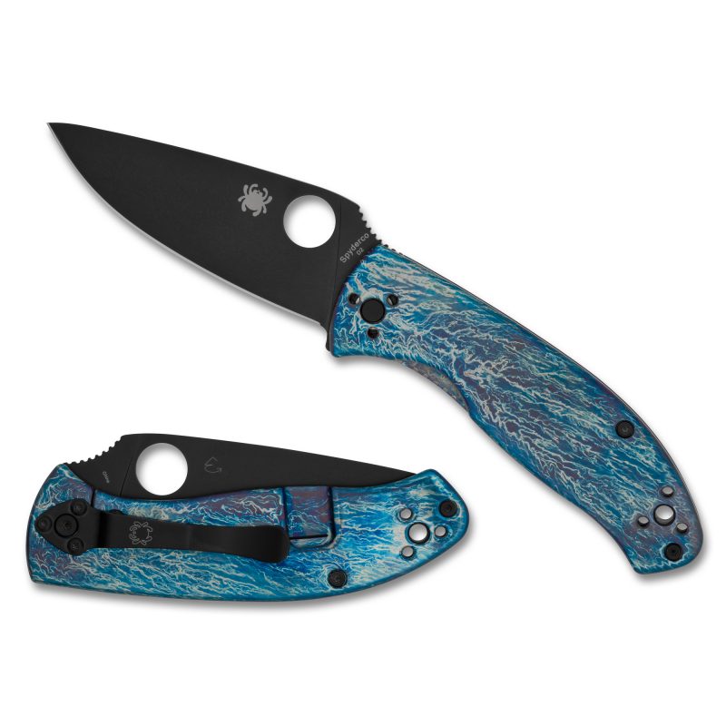 Spyderco Tenacious Ti Disarray folding knife with black blade and blue titanium handle, closed, showing textured handle and pocket clip.