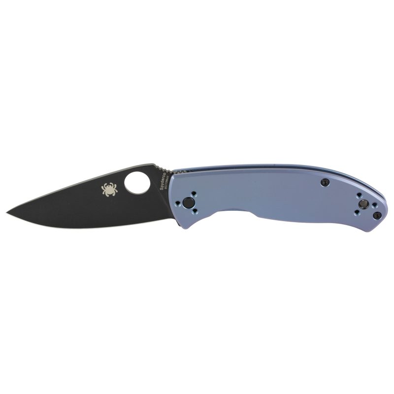 Spyderco Tenacious Ti folding knife with a black blade and blue titanium handle, shown open on a rustic surface.