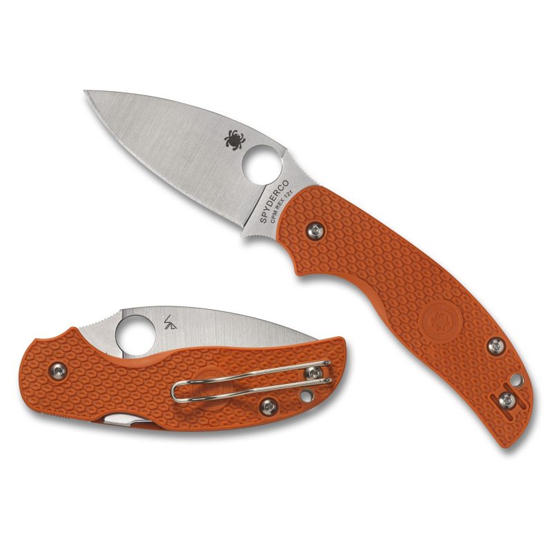 Spyderco Sage 5 Lightweight folding knife with a silver drop point blade and a burnt orange FRN handle, shown open on a rustic surface, ready for ranch work in the White Mountains.
