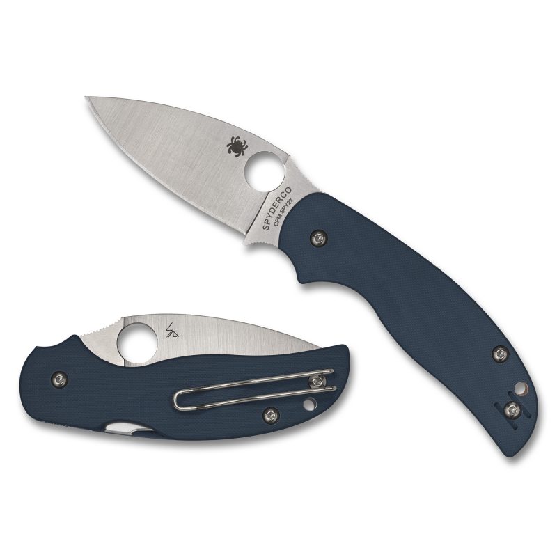 Spyderco Sage 5 folding knife with a silver CPM SPY27 drop point blade and a blue G-10 handle, shown open on a rustic surface.