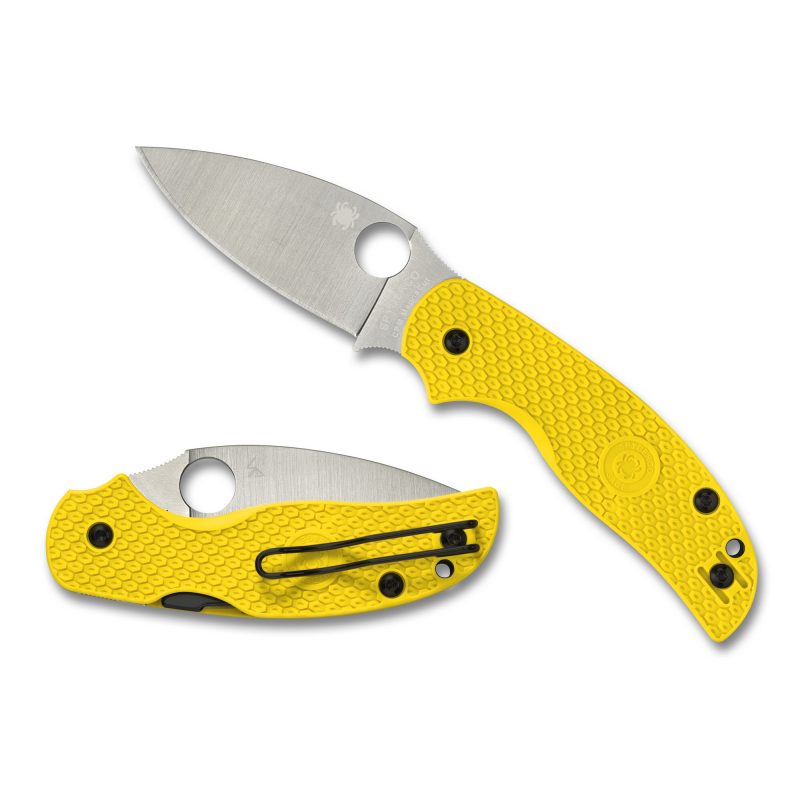 Spyderco Sage 5 Salt 3 inch folding knife with a silver MagnaCut drop point blade and a high-visibility yellow fiberglass-reinforced-nylon handle, shown open on a rustic surface.