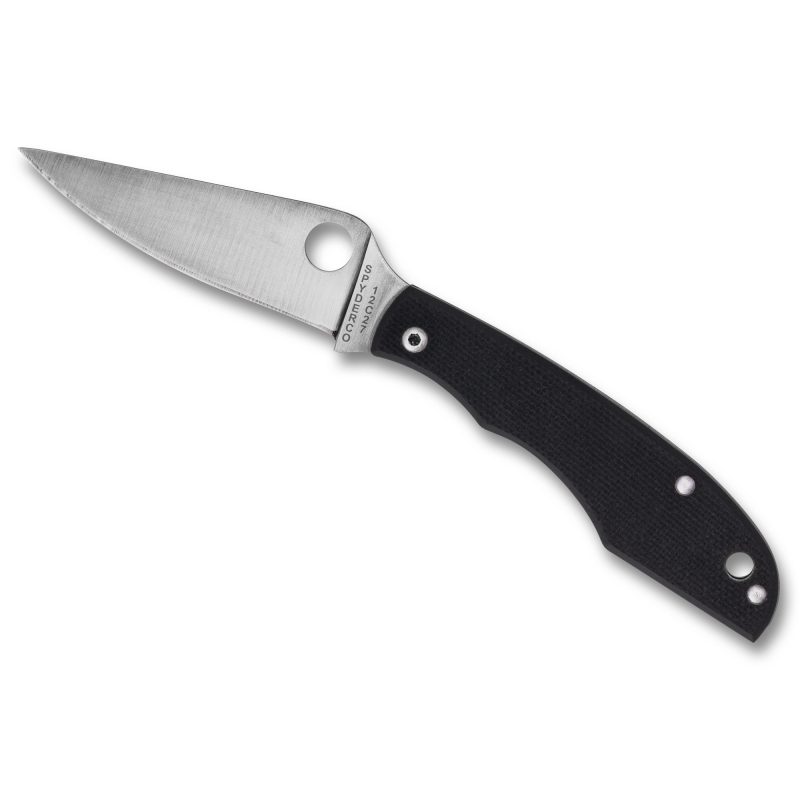 Spyderco Grasshopper G-10 folding knife with a silver 2.3-inch drop point blade and black textured G-10 handle, shown open on a rustic surface.