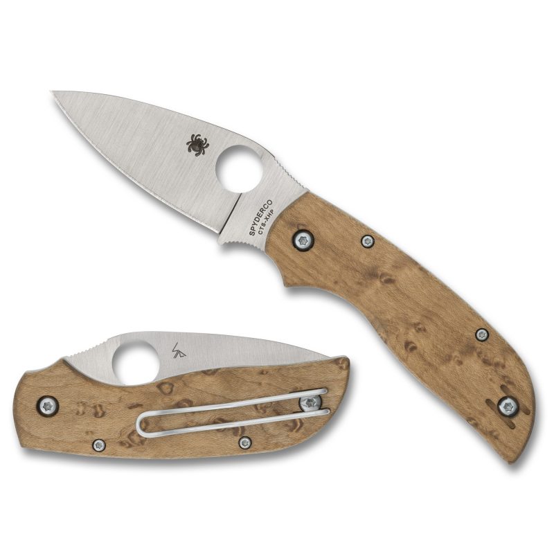 Spyderco Chaparral Slipit folding knife with a silver drop point blade and birdseye maple handle, shown open on a rustic wooden surface.