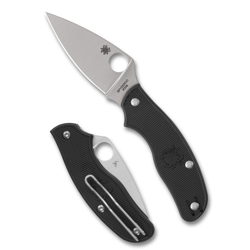 Spyderco Metropolitan Lightweight folding knife with a black FRN handle and a satin-finished drop point blade, shown open on a rustic surface.