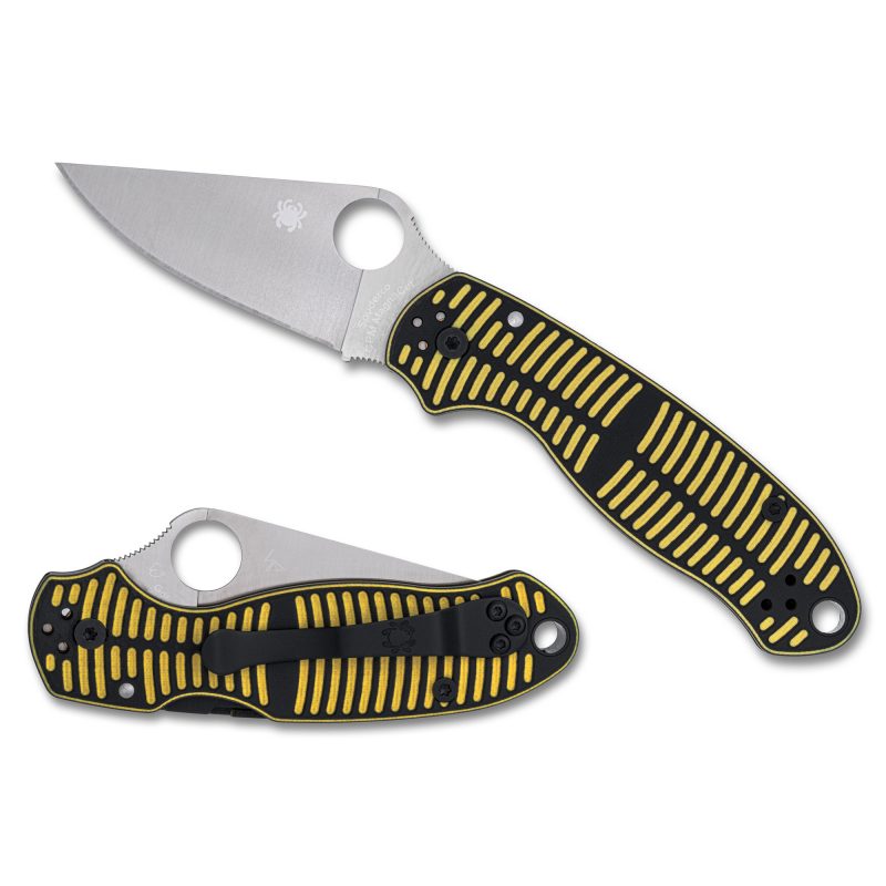 Spyderco Para 3 Salt folding knife with a satin finish MagnaCut blade and a yellow and black G-10 handle, shown open on a rustic surface.