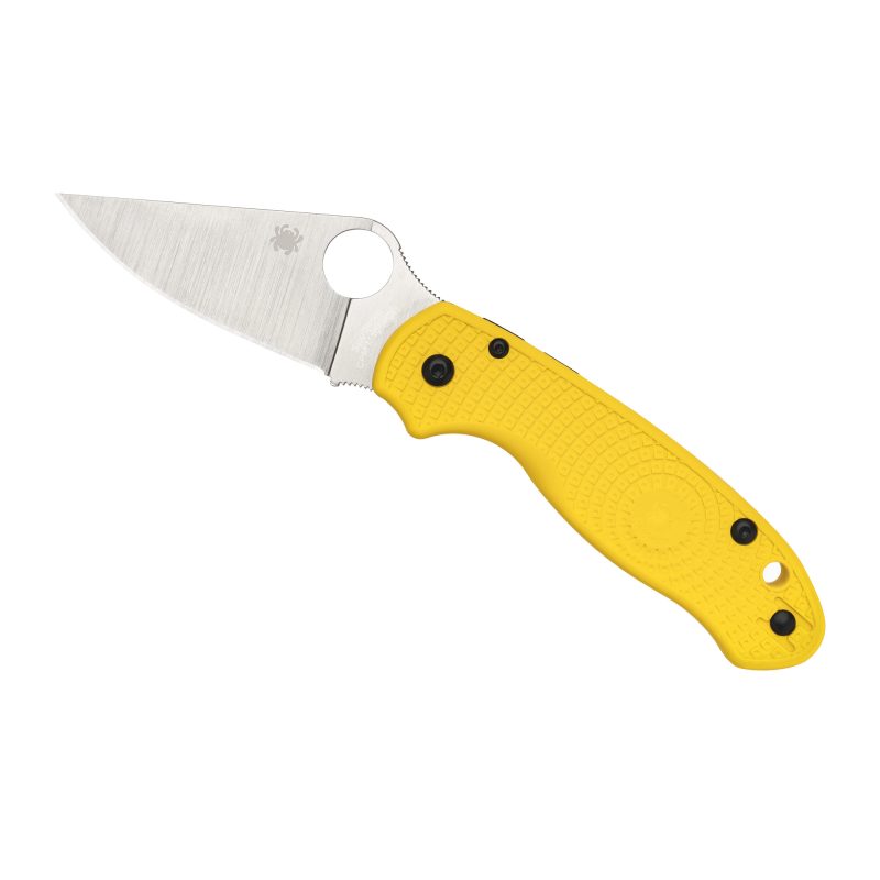 Spyderco Para 3 Lightweight folding knife with a yellow FRN handle and a satin finish CPM Magnacut plain edge blade, shown open on a rustic surface.