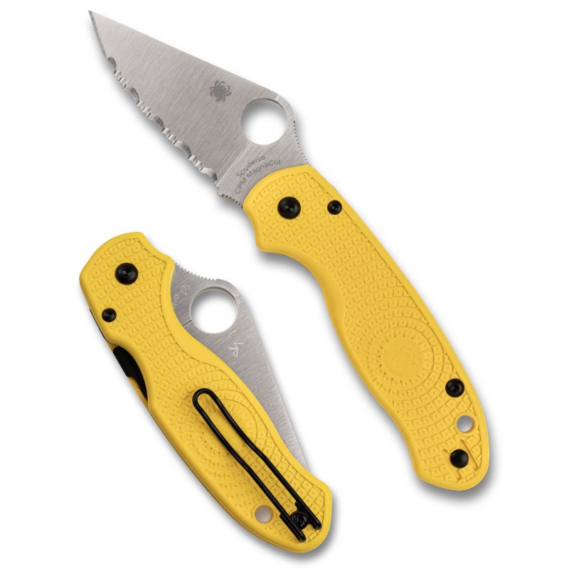 Yellow-handled Spyderco Para 3 Lightweight Salt folding knife with a serrated silver blade, open on a rustic background, showcasing its durable design for outdoor use.
