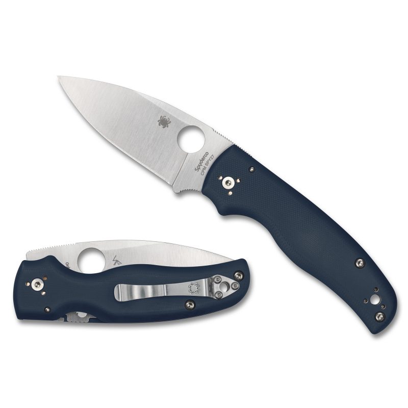 Spyderco Shaman G-10 folding knife with a blue handle and satin finish drop point blade, shown open on a rustic background, ready for ranch work in the White Mountains.