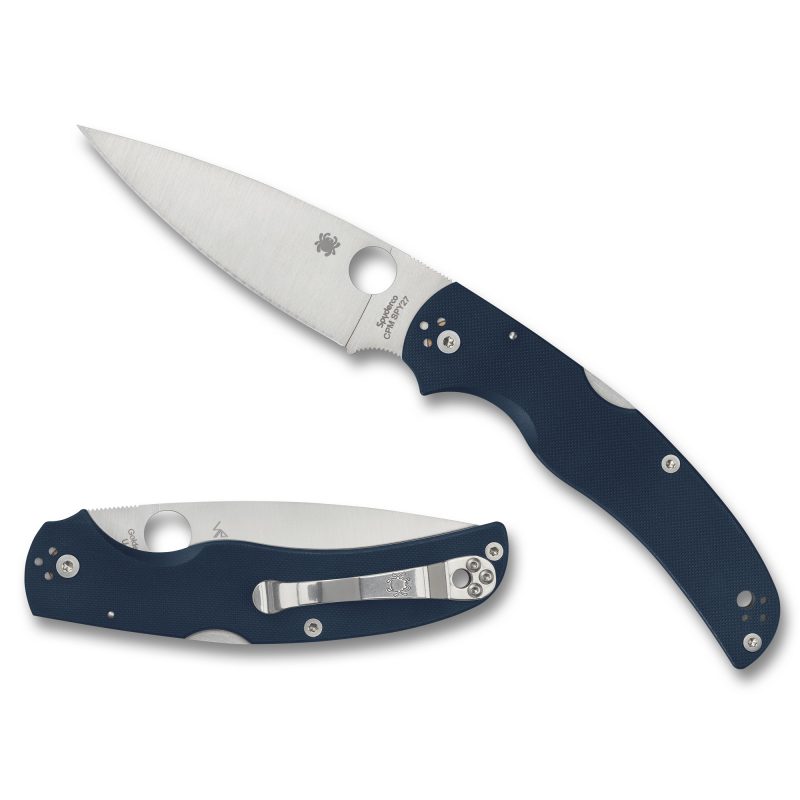 Spyderco Native Chief G-10 folding knife with a blue G-10 handle and satin-finished drop point blade, shown open on a rustic background.