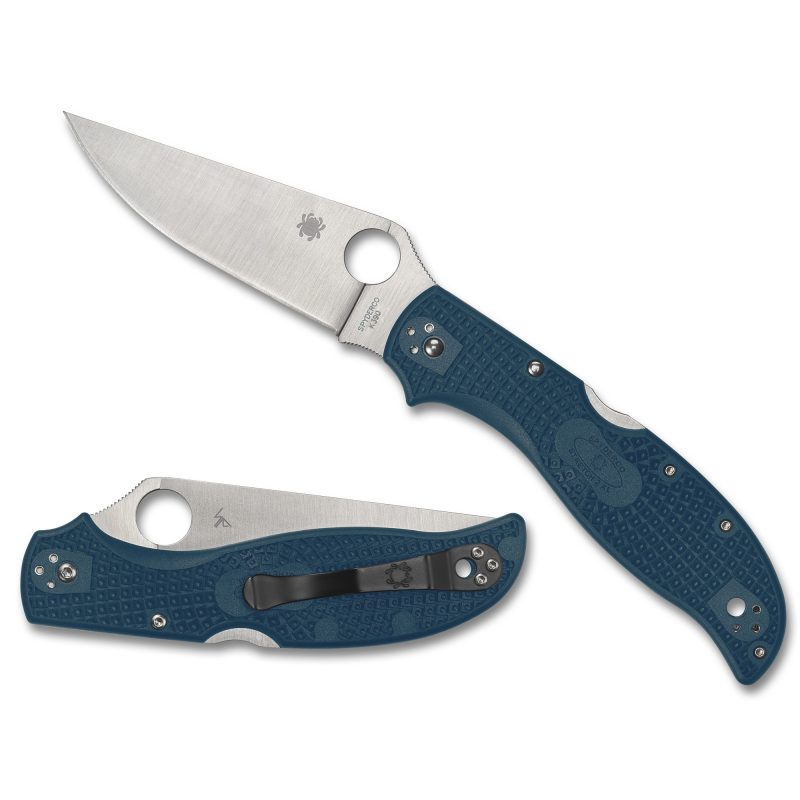 A blue-handled Spyderco Stretch 2 XL folding knife with a satin finish K390 drop point blade, shown open on a rustic background.