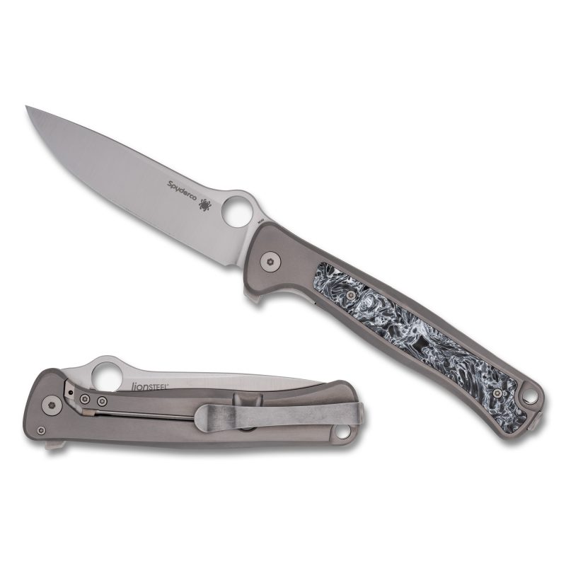 Spyderco Slym folding knife with a stonewash finish M390 drop point blade and a gray titanium handle, shown open on a rustic background.