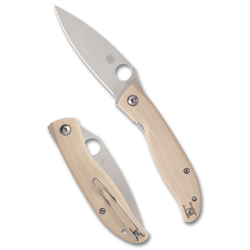 Spyderco Mantra 4 folding knife with a silver drop point blade, white G-10 handle, and a pocket clip, shown partially open.