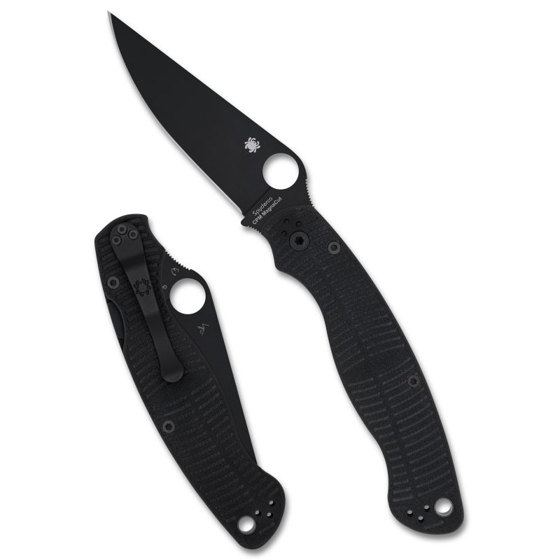 Spyderco Military 2 Salt folding knife with a 4-inch black DLC coated MagnaCut drop point blade and black G-10 handle, shown open on a rugged surface.