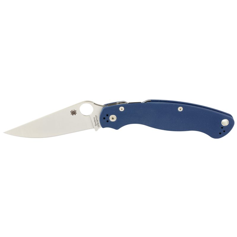 Spyderco Military 2 G-10 folding knife with a silver drop point blade and blue G-10 handle, shown open on a rustic background.
