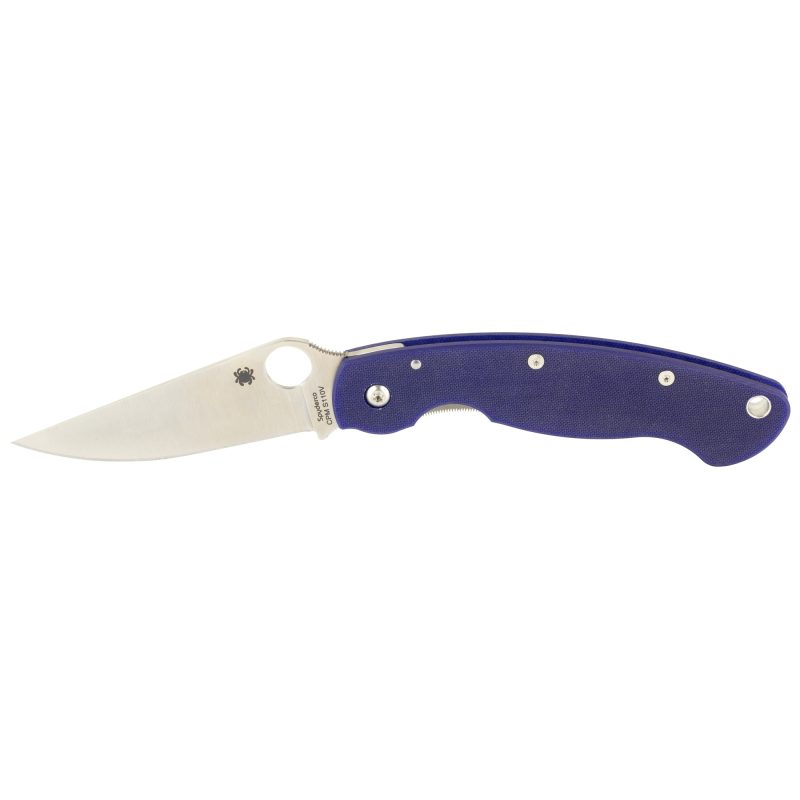Spyderco Military Model G-10 Blue folding knife with a dark blue G-10 handle and a CPM-S110V steel blade, shown open on a rustic surface.