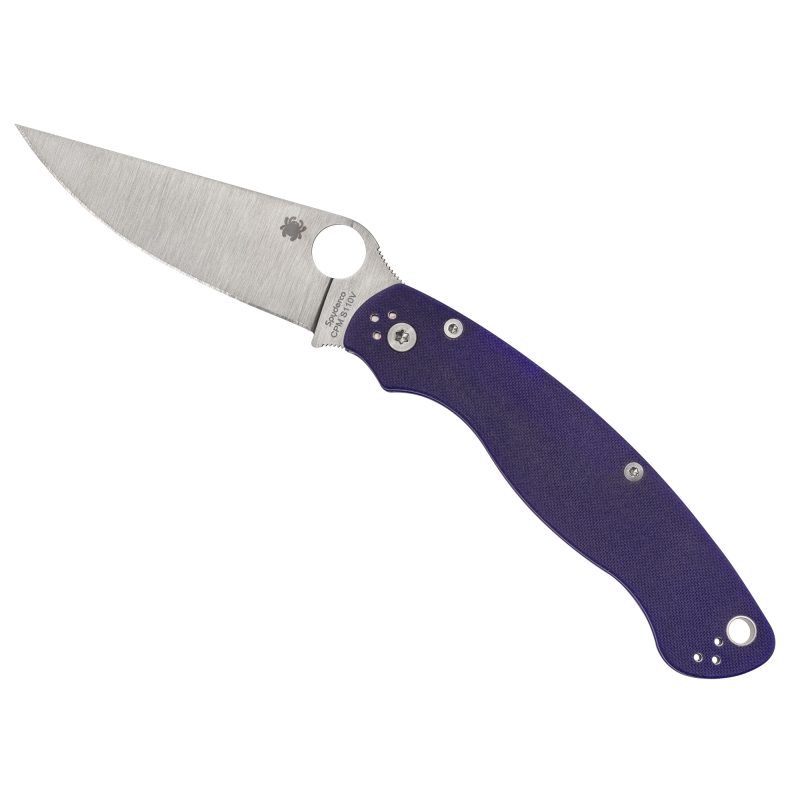 Spyderco Military 2 folding knife with a silver satin finish CPM S110V blade and a dark blue G10 handle, shown open on a rustic background.