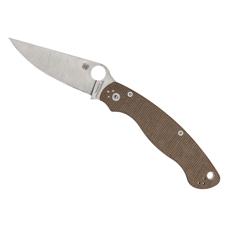 Spyderco Military 2 folding knife with a brown canvas Micarta handle and a satin finish CPM CRU-WEAR tool steel plain edge blade, shown open on a rustic surface.