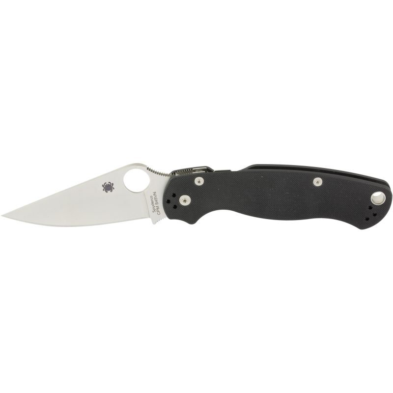 Spyderco Para Military 2 G-10 Plain folding knife with a black G10 handle and a plain edge CPM-S45VN blade, shown open on a rustic surface.