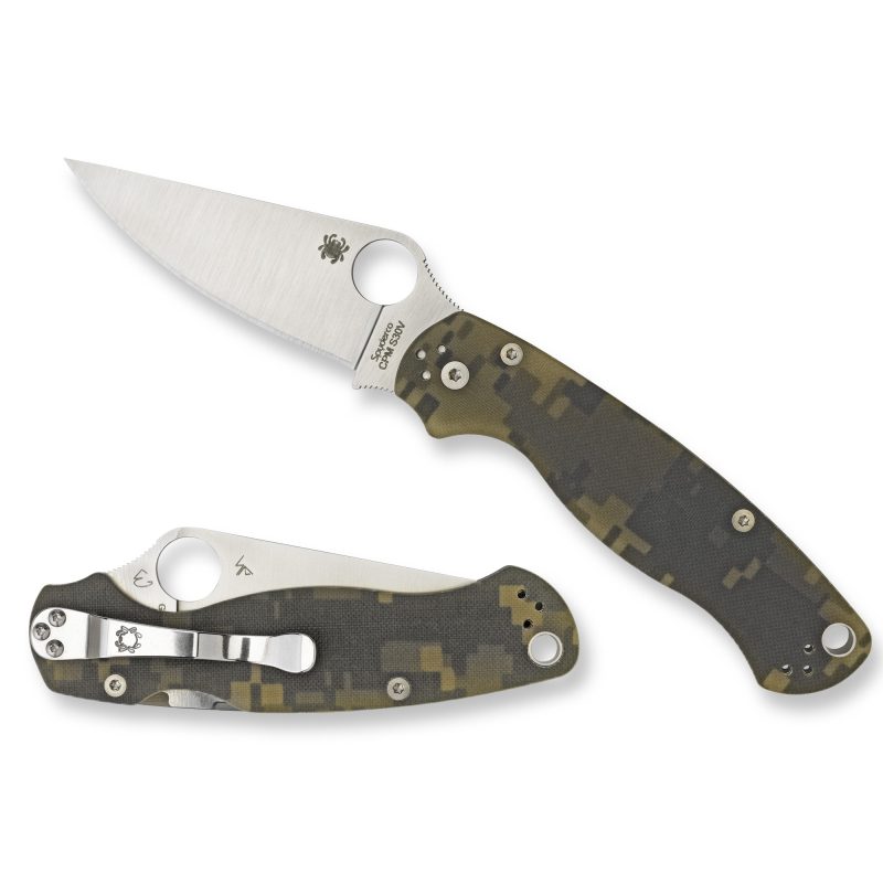 Spyderco Para Military 2 Plain folding knife with digital camo G-10 handle and satin CPM-S45VN blade, shown open on a wooden surface.