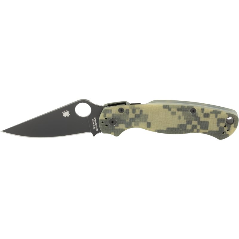 Spyderco Para Military 2 folding knife with a black DLC finished clip point blade and a camouflage G10 handle, shown open on a rustic surface.