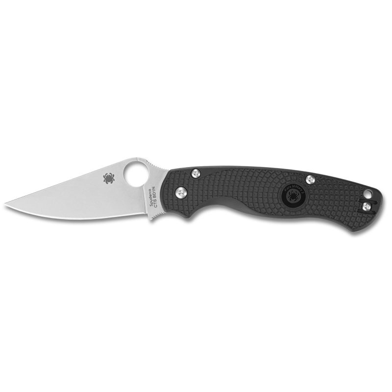 Spyderco Para Military 2 Lightweight folding knife with black FRN handle and satin silver plain edge blade, shown open on a rustic surface.