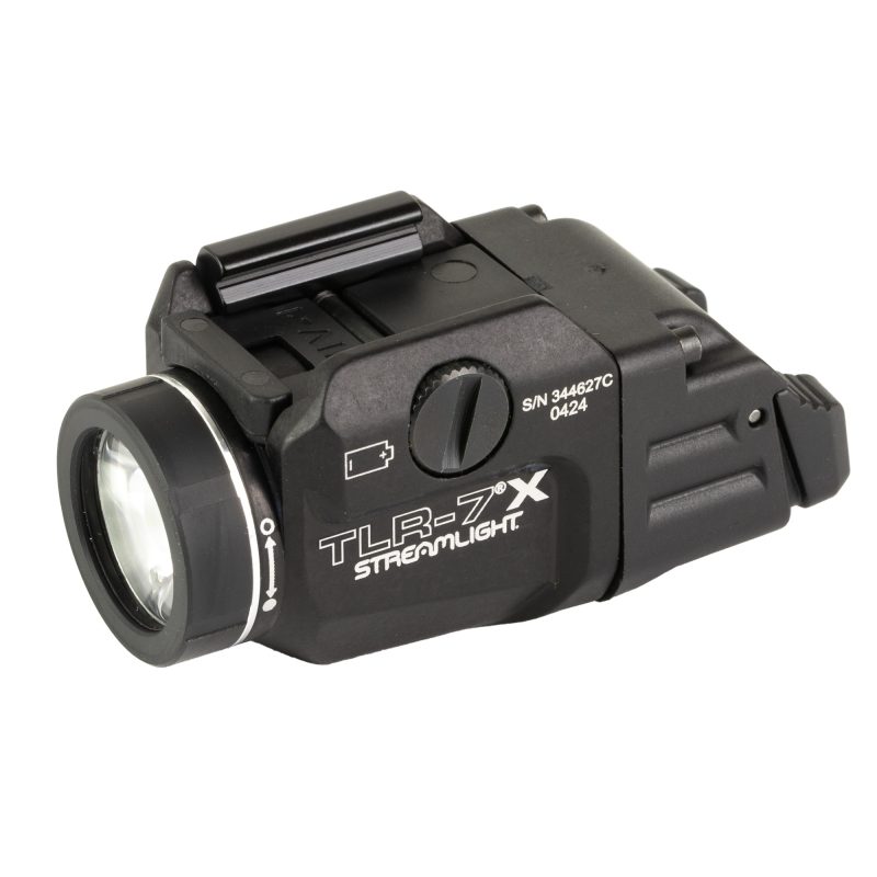 Black Streamlight TLR-7 X weapon light mounted on a firearm rail, showing the compact design and rear paddle switches.